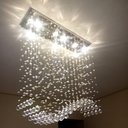 Ver imagem 5 de Lustre de Cristal para Mesa de Jantar com 70cm de Altura e Base de Inox Espelhado de 70x20cm