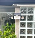 Ver imagem 2 de Luminária Solar com Sensor e Controle Remoto 218 Leds 3 Cabeças e Placa Acoplada