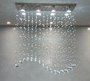 Ver imagem 4 de Lustre para Mesa de Jantar de Cristal Tipo Onda Base de Inox 70x20cm com 70cm de Altura
