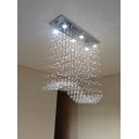Ver imagem 1 de Lustre para Mesa de Jantar de Cristal Tipo Onda Base de Inox 70x20cm com 70cm de Altura