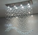 Ver imagem 5 de Lustre para Mesa de Jantar de Cristal Tipo Onda Base de Inox 70x20cm com 70cm de Altura