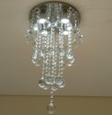 Ver imagem 2 de LUSTRE DE CRISTAL PARA SALA COM 80 CM DE ALTURA BASE DE INOX 30 CM DE DIÂMETROS