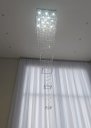 Ver imagem 1 de Lustre para Pé Direito Duplo Base de Inox Polido Espelhado de 70x70cm com 2,5 Metros de Altura