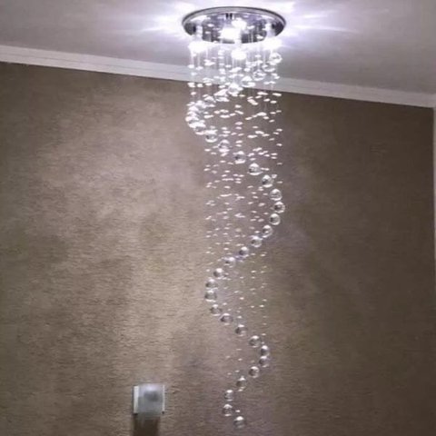 LUSTRE ESPIRAL COM 1,30 METROS DE ALTURA,BASE DE INOX 30CM DE DIÂMETROS,CRISTAIS LEGÍTIMOS K9