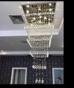 Ver imagem 1 de Lustre de Cristal com 1,80 Metros de Altura,Para Pé Direito Duplo,Base de Inox Espelhado de 70X70 Cm