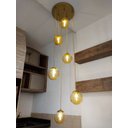 Ver imagem 1 de Pendente Moderno Dourado Pé Direito Alto Sala Vão de Escada Arevo Iluminação Jabuticaba VIDRO ÂMBAR