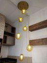 Ver imagem 1 de Pendente Moderno Dourado Pé Direito Alto Sala Vão de Escada Arevo Iluminação Jabuticaba VIDRO ÂMBAR