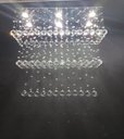 Ver imagem 2 de LUSTRE DE CRISTAL PARA SALA DE JANTAR/ESTAR COM 90CM DE ALTURA, BASE DE INOX ESPELHADO COM 70X20CM