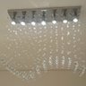 Lustre de Cristal para sala de jantar com 65cm de altura e base de inox espelhado de 70x18cm e 07 lâ - 2