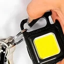 Ver imagem 2 de Lanterna Recarregável Chaveiro Multifunção Led com Abridor