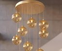Ver imagem 2 de Pendente Moderno Dourado 15 Globos Pé Direito Duplo Escada