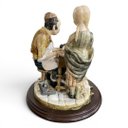 Ver imagem 4 de Escultura Decorativa em Porcelana a Menina e o Sapateiro 28X26X26cm