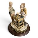 Ver imagem 3 de Escultura Decorativa em Porcelana a Menina e o Sapateiro 28X26X26cm