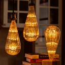 Ver imagem 1 de Kit 2 Lâmpadas Led Taschibra Vintage Fireworks Bt125 E27 Bivolt 2200k Amarelo Âmbar