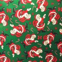 Ver imagem 4 de Toalha de Mesa Redonda Gorgurinho Papai Noel Fundo Verde - 1,50M
