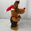 Ver imagem 3 de Rena Natalina Musical Dançarina Boneco de Natal Roupa Xadrez Decoraçao Mesa Estante Sala Escritorio 