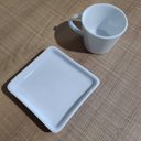 Ver mais imagens de Kit 12 Xícaras de Café 90ml em Porcelana Branca com Pires Quadrado Germer