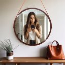 Ver mais imagens de Espelho Redondo Adnet Decorativo Suspenso com Alça 60cm + Suporte Marrom com Alça Caramelo