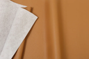 Ver imagem 4 de Poltrona Womb Chair com Puff em Couro Ecológico Caramelo