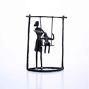 Ver imagem 1 de Escultura Em Metal Preto Balanço 18x13,5cm