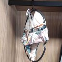 Ver imagem 4 de Kit 50 Cabides Redondos para Biquíni Lingerie Plástico Preto Redondo Loja Cinquetti