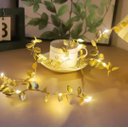 Ver imagem 1 de Fio de Ouro Decorativo com Luzes LED e Folhas Douradas Cordao Luminoso Flexível para Decoração de Am