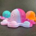Ver imagem 7 de Chaveiro Polvo Reversível Pop It Fidget Toy Brinquedo Anti Stress Apertar TikTok Silicone Sensorial 